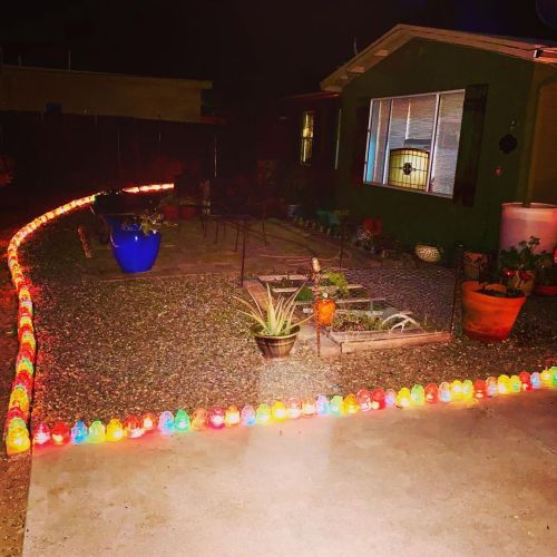 Richard has quite the collection of glass insulators. He lined our front patio and put Christmas lig