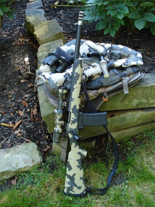 gunrunnerhell: Remington 700 Custom built 700 by Breakneck Creek Precision Rifle Co (BNCP). This is chambered in .458 SOCOM, hence the AR-15 magazine adapter. Generally .458 SOCOM is a heavy hard hitting but short range caliber for the AR platform, a
