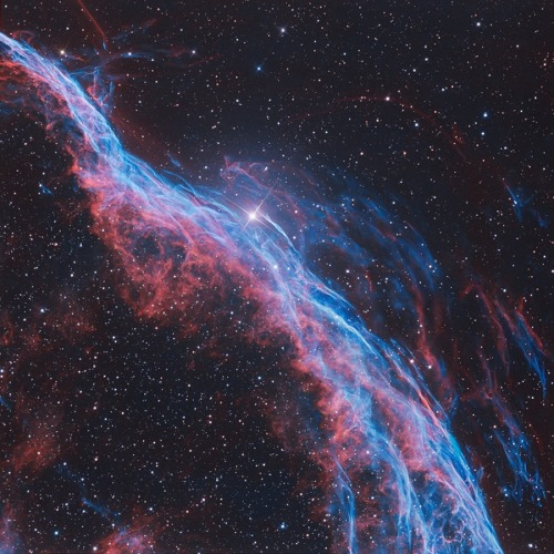 The Veil Nebula is a cloud of heated ionized gas and dust in the constellation Cygnus, and makes up 