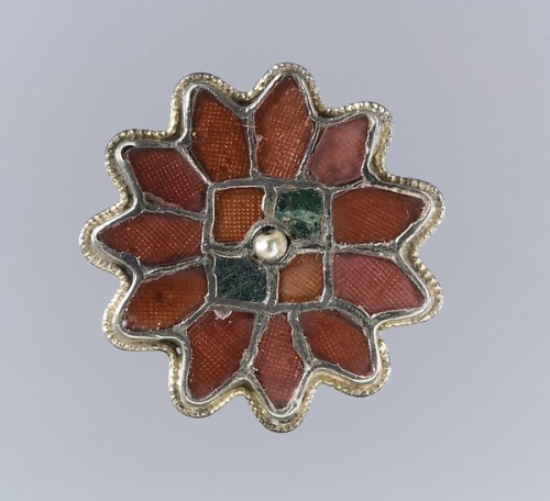 Frankish silver-gilt and garnet brooches, 6th centuryGarnets, worked in the cloisonné technique, fea