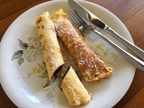 Egg + cream cheese crepes with blueberry + lemon zest filling, topped with coconut