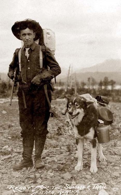 A prospector and dog are ready for the summer trail.Seward, Alaska during the Klondike Gold Rush, 18