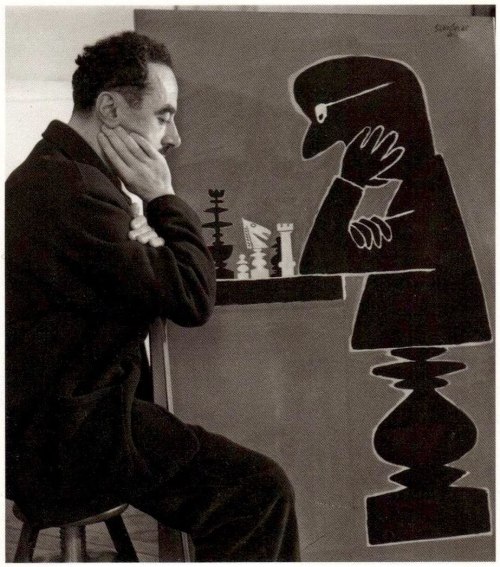 Raymond Savignac playing chess, 1950 by  Robert Doisneau