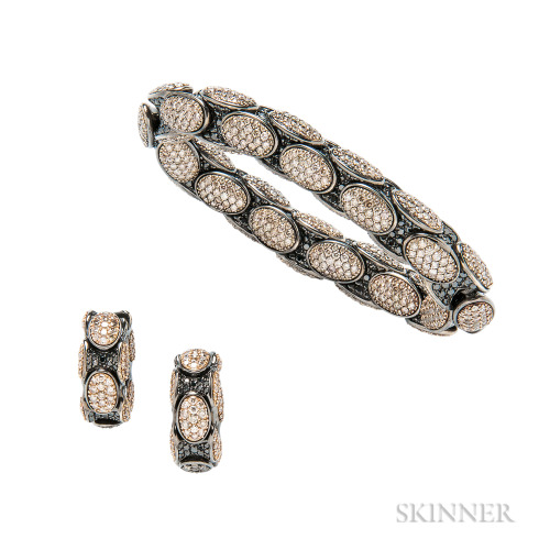 Brown diamond, black diamond, and blackened gold &lsquo;Anaconda&rsquo; flexible bracelet and earrin