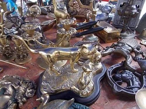 Brass, bronze &amp; other metals merchandise offered on antiquities market in Wroclaw, Poland.