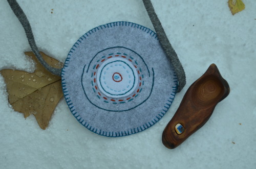 Wooden spoon in felt case. 