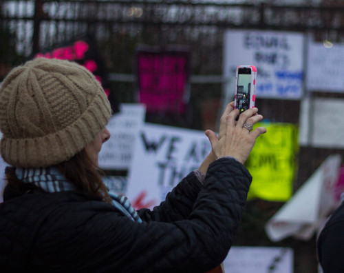 January 21st, 2017 || Philadelphia, PA.people admiring the leftover signs displayed around the overp