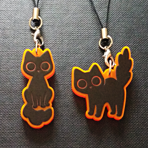 starpatches:Black cat charms on fluorescent orange acrylic!http://starpatches.tictail.com/product/bl