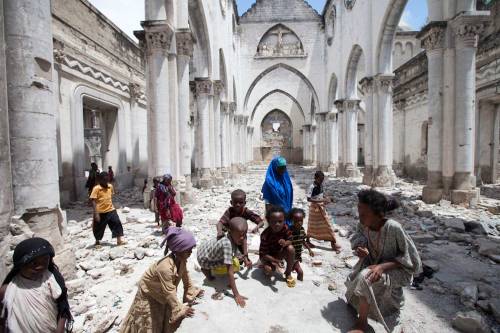 Children play in the ruins of the Mogadishu Cathedral, destroyed by the al-Shabaab in 2008.> Phot