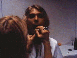 needforcolorbis:   Kim Gordon putting lipstick