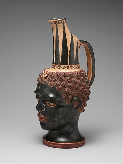 afro-textured-art: An Etruscan terracotta vase in the form of a black African youth’s head - Classical Italy, 4th century B.C. Metropolitan Museum of Art, New York City.