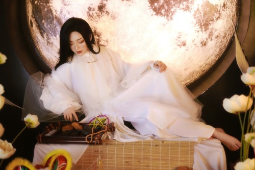 A Moon Festival-inspired white fantasy áo tấc, with elements of Hằng Nga, the moon goddess. T