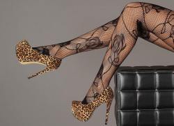 legs-heels:  Leopard heels in fishnet thigh highs with black roses 