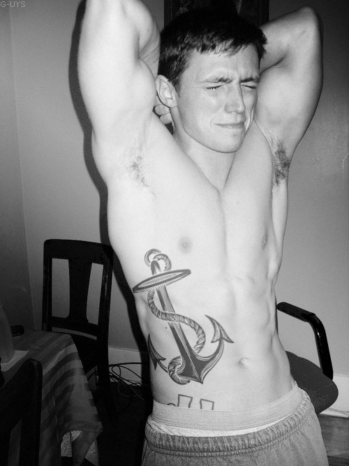 Not sure what that look is all about.  I like the tattoo, had to hurt.  Would love to see a color version.  His abs and chest aren’t bad either.