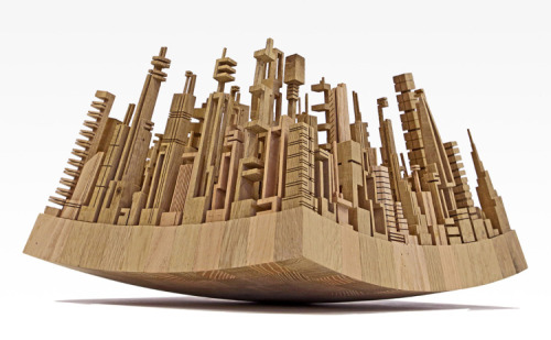 archiemcphee:  Philadelphia-based artist James McNabb transforms scraps of wood into awesome assemblages of architectural shapes, dazzling cityscapes made of repurposed wood that sometimes resemble tables and wheels. McNabb describes his unique form of