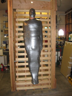 bondagejock:    Suspended mummification.