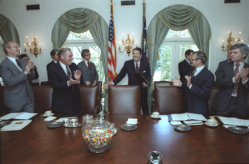 President Reagan attends his first cabinet meeting after the assassination attempt. From left to right: James Watt, Alexander Haig, Martin Anderson, President Reagan, Frank Carlucci, JosephWright. 4/24/81.