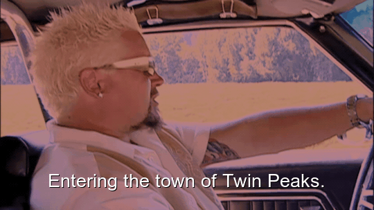 80% sure it's a man driving a car. Caption: Entering the town of Twin Peaks.