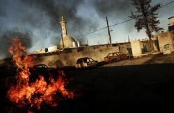 plizm:    Moises Saman - Aftermath of an insurgent attack on an Iraqi police station in the western district of Mosul, 2005