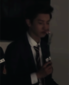gongyoop-deactivated20170703:chanyeol smelling his rose but doesnt quite like the smell of it..
