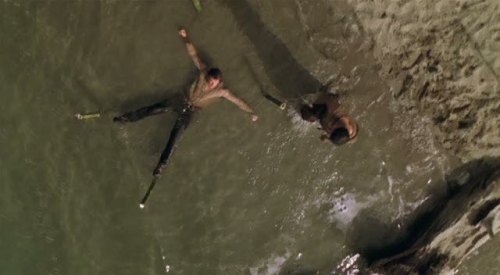 Riverworld (2003) A man staked out in water
