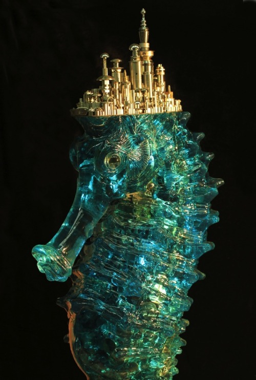 Chinese artist Hu Shaoming created this sculpture of a seahorse being crushed by the industry above.