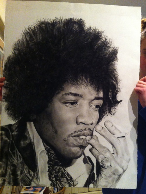 Near completion. My sister holding my charcoal of Jimi Hendrix. Starting my next one soon. #charlie 