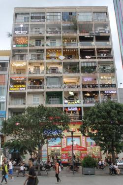 sixpenceee:  Almost every balcony in this Vietnam building is a restaurant/cafe.(Picture Source)