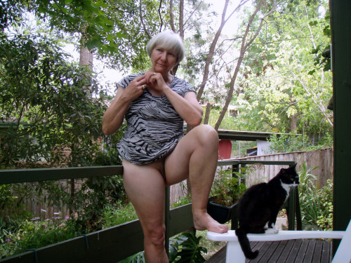 jemcasey:  Lyn, our lovely Australian granny gets naked on the deck…   Who could resist bending her over that rail and giving her hairy cunt a thorough drilling? Even though pussy seems indifferent to mistress’s charms!