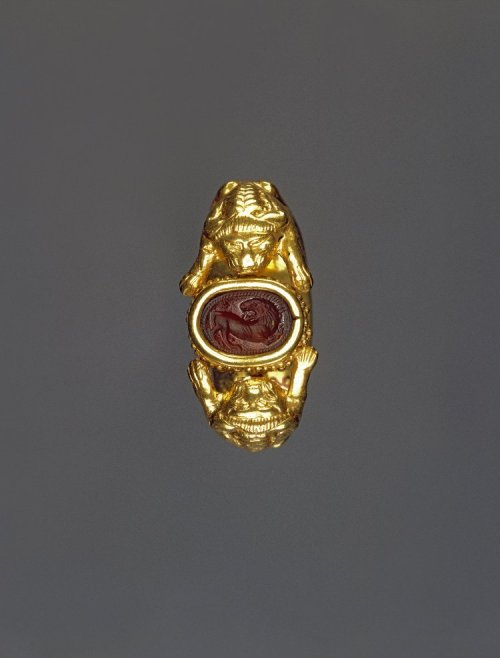 records-of-fortune:Etruscan. Gold Ring. 5th Century BC. This Gold finger-ring has two crouching lion