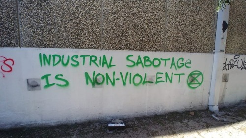 “Industrial sabotage is non-violent”Extinction Rebellion graffiti in Melbourne