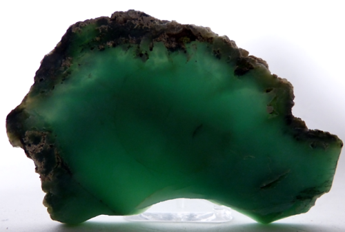  CHALCEDONY (CHRYSOPRASE) from Newman, Western Australia. Partly backlit to show gem quality.