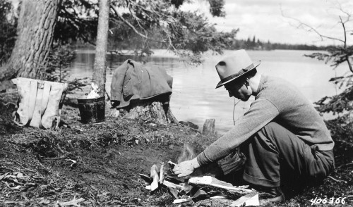 vintagecamping: A Forest Ranger demonstrating how to build a camp fire, clear duff away, and put out