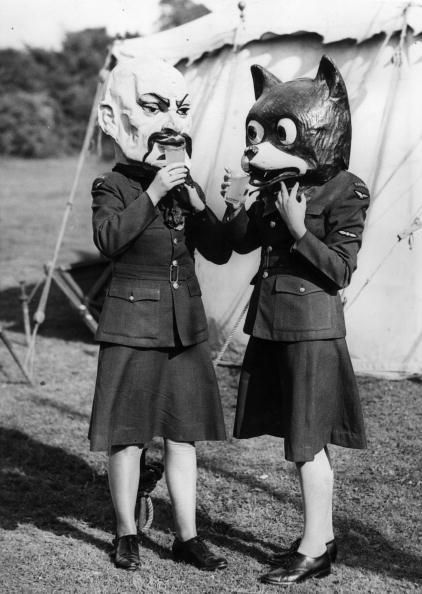 through-a-historic-lens:Two Canadian airwomen wearing carnival heads have a drink at a victory party