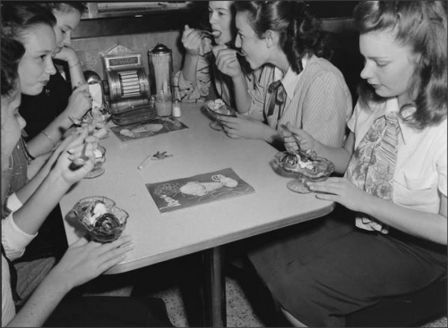 High School girls enjoy ice cream at the local soda shop, 1947Cornell Capa