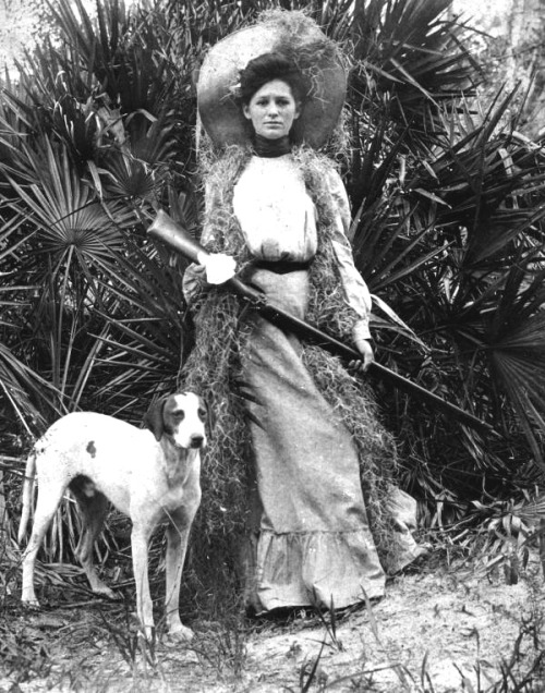 Woman with shotgun and dog, Florida, early 1910s.Note her “Spanish Moss” camouflage. Sou