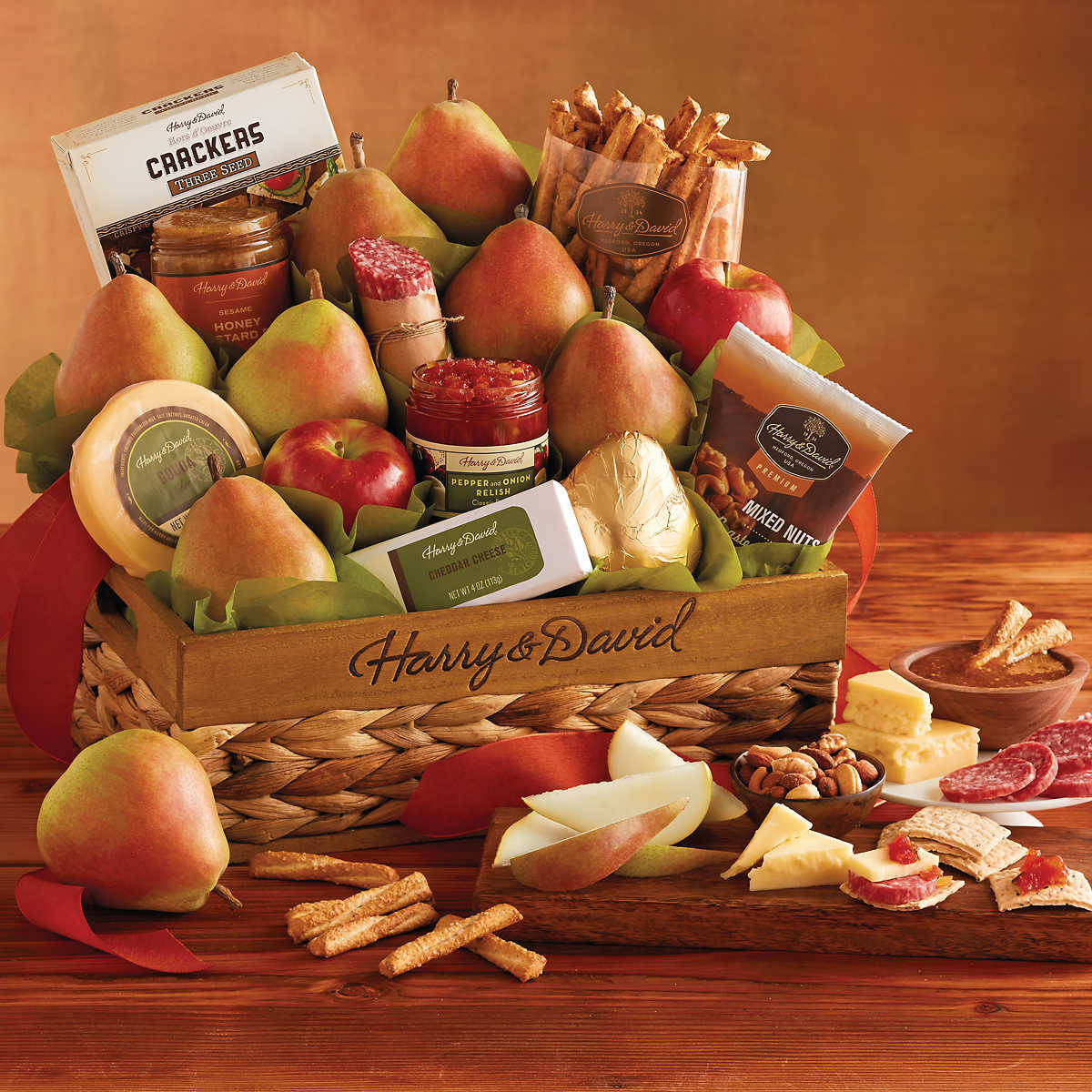 Fruits, nuts, sausages, cheeses and crackers all packaged together and sent to each