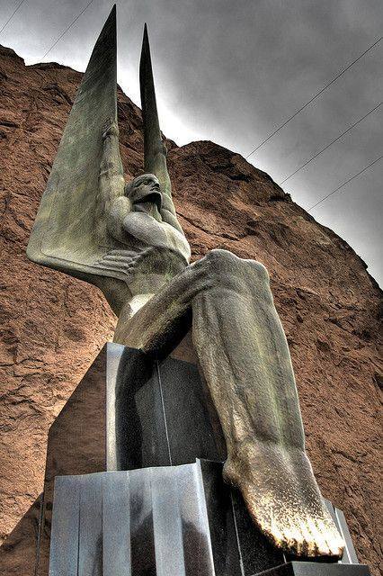 anyskin:Hoover Dam Angel - Two 30-foot tall bronze sculptures by Oskar Hansen at Hoover Dam are an unusual depiction of male angels. They are part of Hansen’s work to memorialize the workers killed during the construction of the dam. “Winged Figures