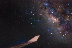 just–space:  Bright stars of Sagittarius and the center of our Milky Way Galaxy lie just off the wing of a Boeing 747  js 