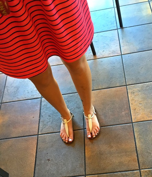 Sexy hot chick&rsquo;s beautiful face and pretty feet with white toenails candid at the coffee shop.