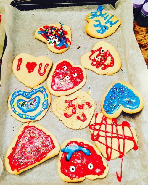 Family feast! And our attempt at valentines days cookies. Pathetic but so yummy!! by sunnyleone