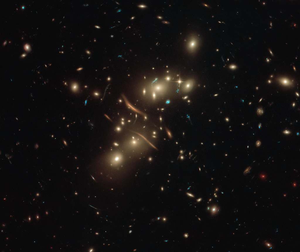 Hubble Watches Cosmic Light Bend by NASA’s Marshall Space Flight Center