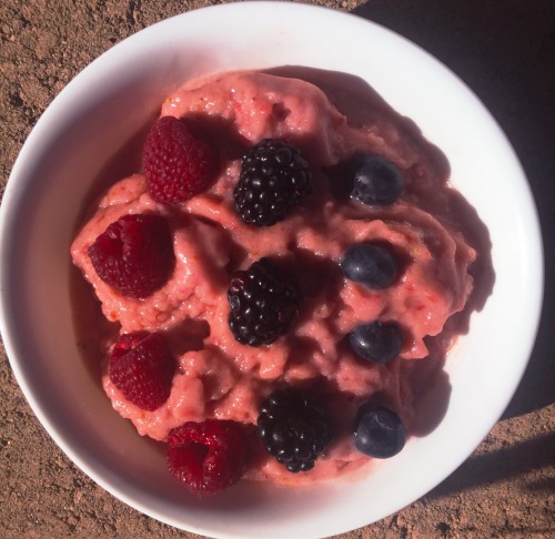 nicecream from a while ago frozen bananas and strawberries blended up, and topped with fresh raspber