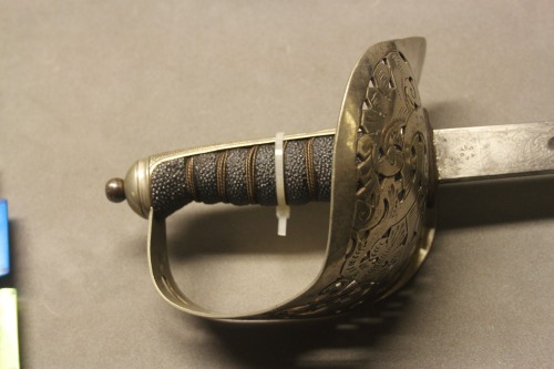 victoriansword:  barbucomedie:  beardedkomedy:  Cavalry sword with a bowl cross guard and sharkskin handle from the mid 19th century. The cross guard is wonderfully ornate as well as the blades fuller.  Update, this is not a cavalry sword but a British