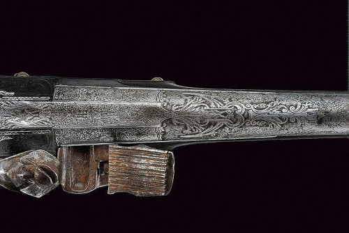 An engraved, silver and red coral decorated flintlock pistol marked “Cominazo Lazaro”, I