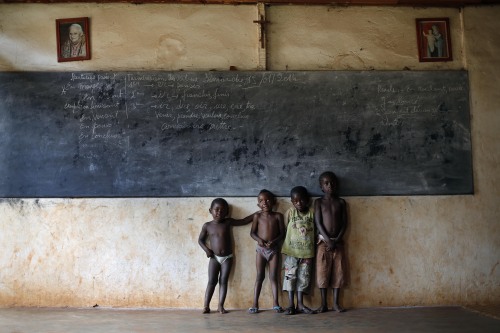 Children who found refuge in the cathedral in Mbaiki pose for the photographer in Central African Re