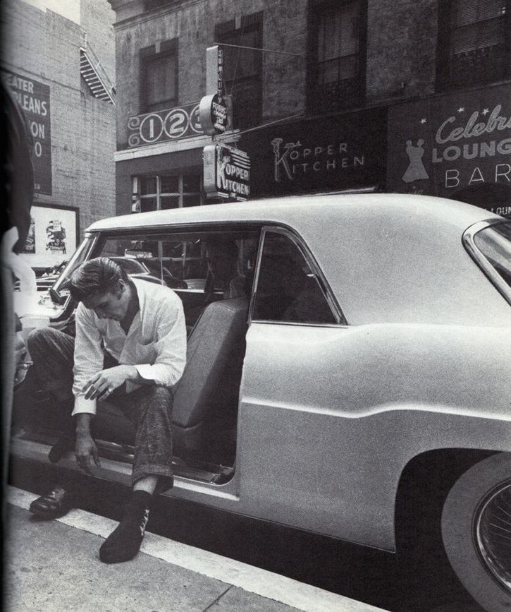 elvis-pink-cadillac:  Elvis sitting in his Continental Mark II, putting on his shoes