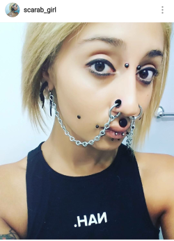 thedarkdungeon:  bondagepervert:Absolutely love the chains from her nostril piercings to her ears! SEXY!  To its ear. :)