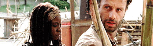 fuckyeahrichonne:Michonne looking stoic and Rick looking like a delicate flower