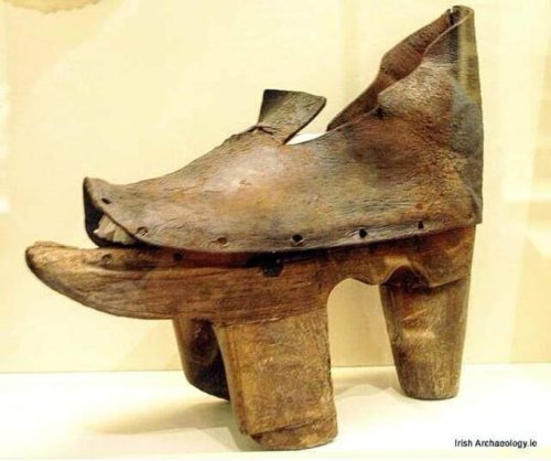 A 15th/16th century wooden patten and leather shoe from Co Kildare. The patten helped elevate the sh